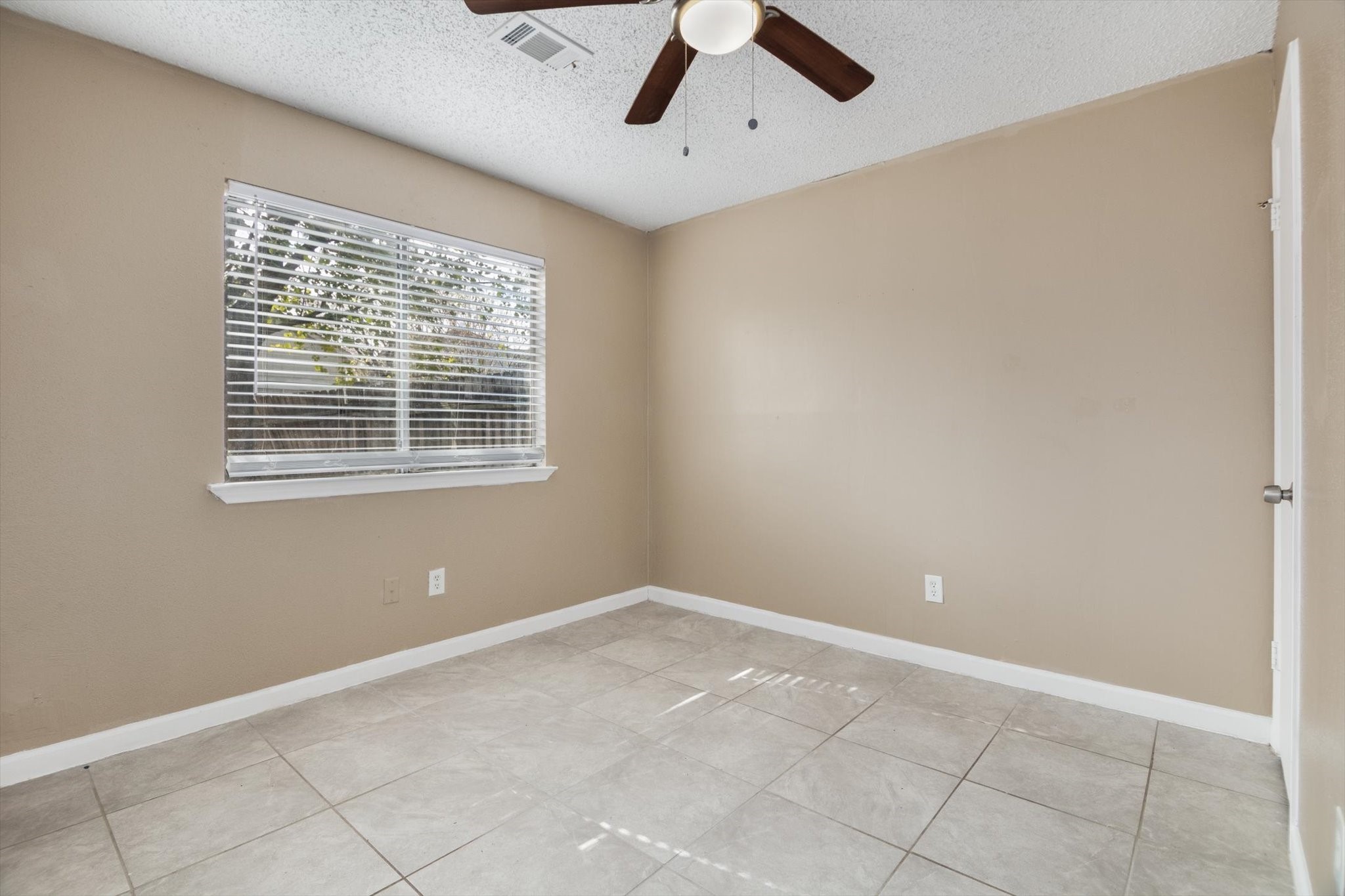 4403 Conward Drive Houston, TX 77066 - Photo 19 of 25 a view of an empty room with a window