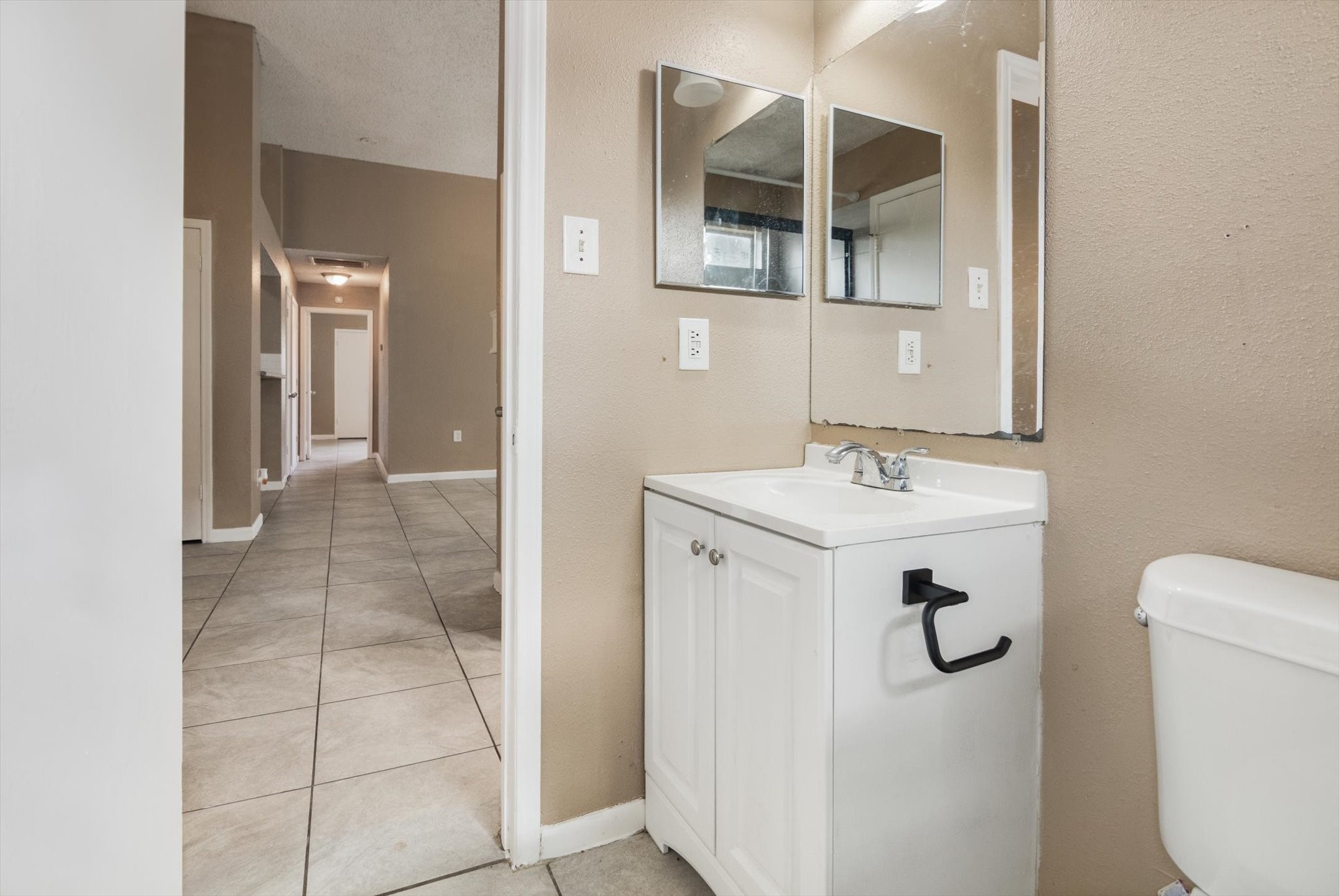 4403 Conward Drive Houston, TX 77066 - Photo 23 of 25 a bathroom with a sink and mirror