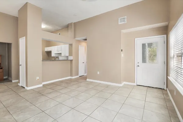 a view of a kitchen with a sink and a fireplace