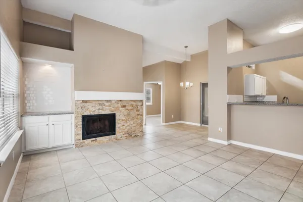 an empty room with closet and a bathroom