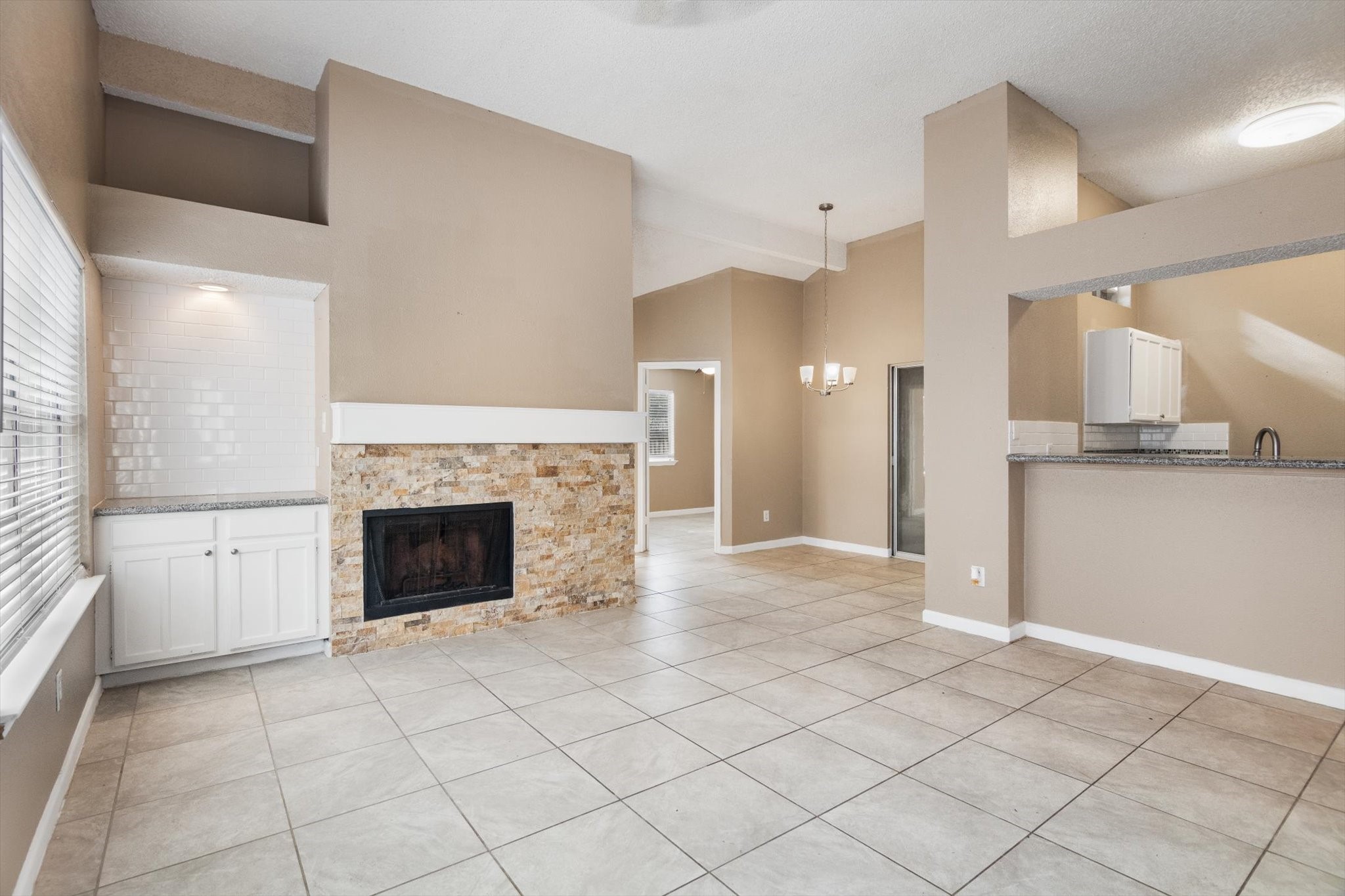 4403 Conward Drive Houston, TX 77066 - Photo 6 of 25 a view of a kitchen with a sink and a fireplace