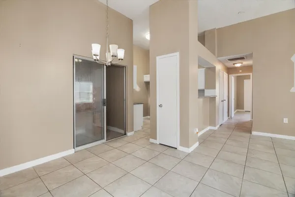 a kitchen with granite countertop white cabinets and a sink