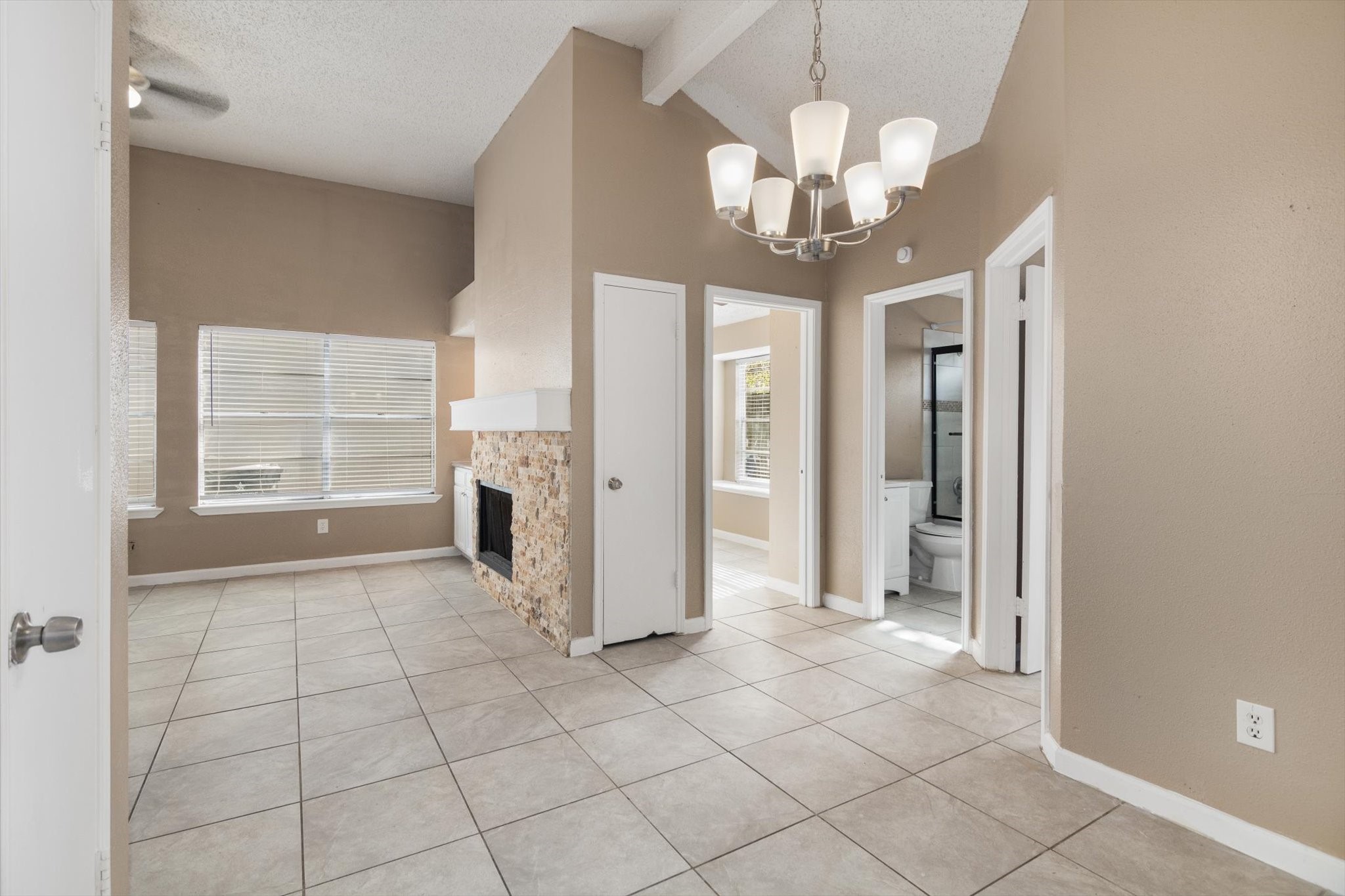 4403 Conward Drive Houston, TX 77066 - Photo 9 of 25 a view of an empty room with a fireplace and a window