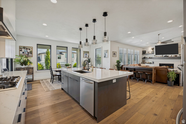 13257 Sky Rnch Road Herriman, UT 84096 - Photo 12 of 17 Expansive kitchen island with an integrated sink and pendant lighting