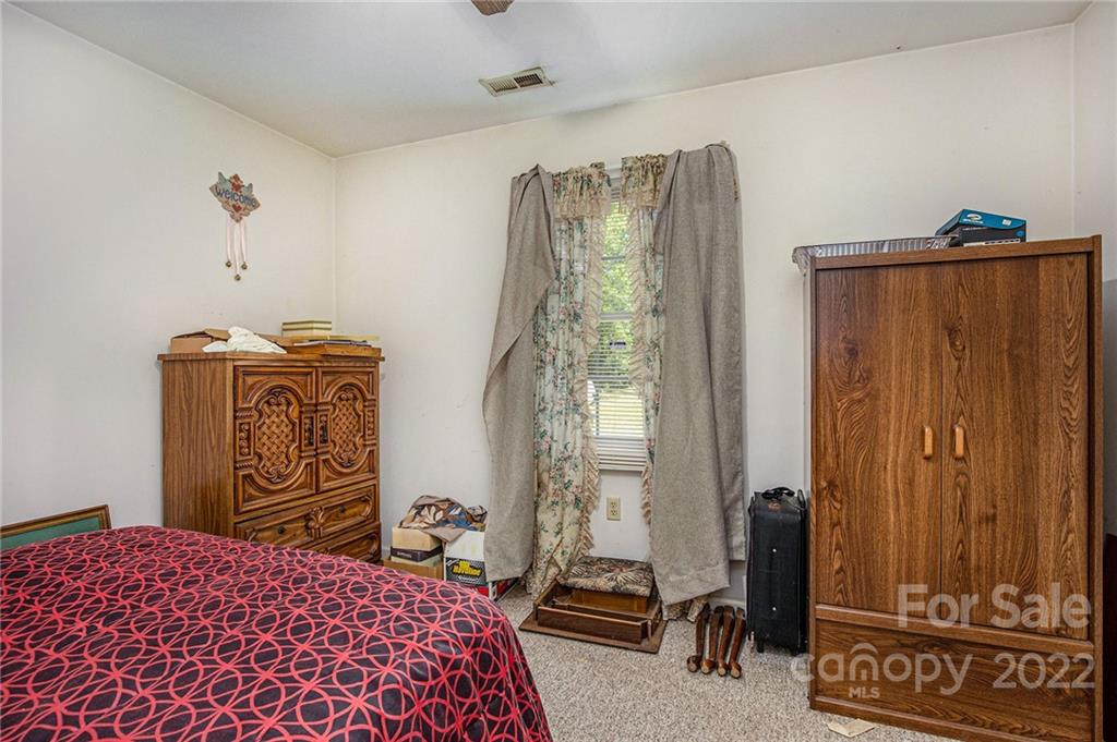 340 Sally Blackwell Road Pageland, SC 29728 - Photo 14 of 30 a bedroom with a bed and a window