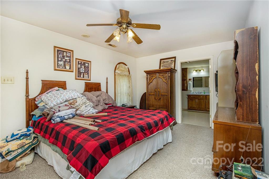 340 Sally Blackwell Road Pageland, SC 29728 - Photo 17 of 30 a bedroom with a bed and a walk in closet