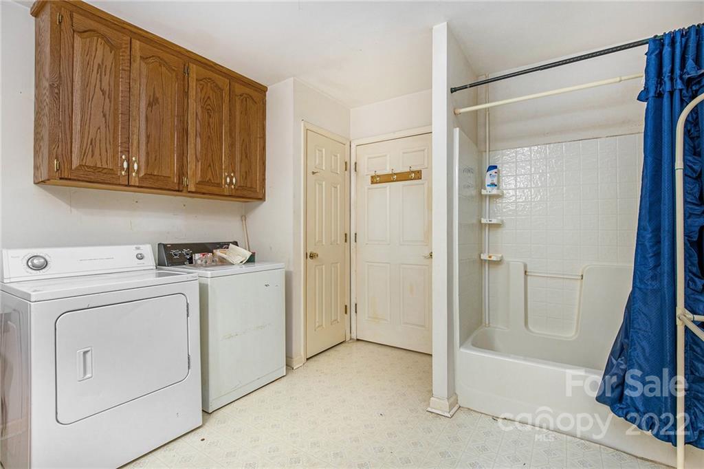 340 Sally Blackwell Road Pageland, SC 29728 - Photo 20 of 30 a view of washer and dryer with kitchen in the background