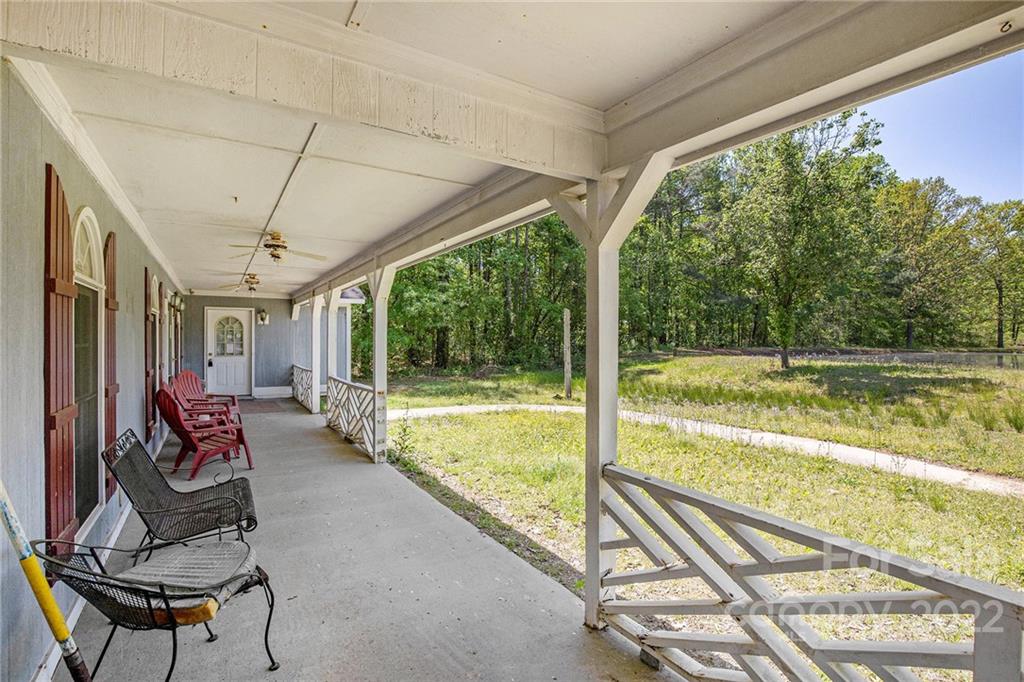 340 Sally Blackwell Road Pageland, SC 29728 - Photo 2 of 30 a swimming pool with outdoor seating and yard