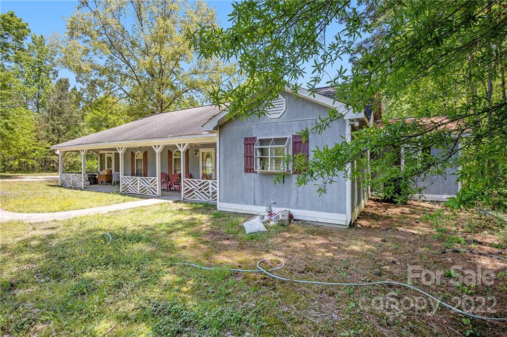 340 Sally Blackwell Road Pageland, SC 29728 - Photo 23 of 30 a view of a house with a yard and large tree