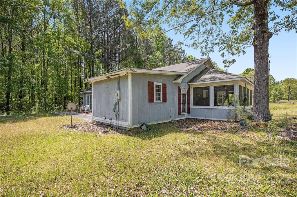 340 Sally Blackwell Road Pageland, SC 29728 - Photo 24 of 30 a house with trees in the background