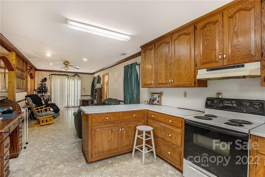 340 Sally Blackwell Road Pageland, SC 29728 - Photo 5 of 30 a kitchen that has a sink and a stove