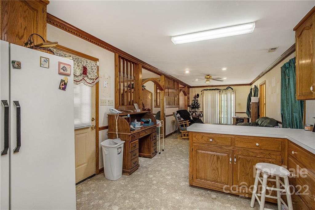 340 Sally Blackwell Road Pageland, SC 29728 - Photo 6 of 30 a large white kitchen with a large window
