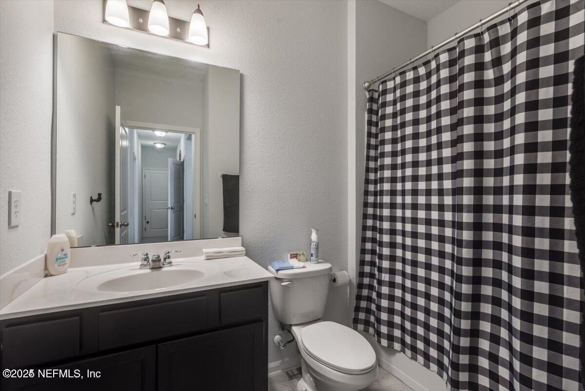 668 Watervale Drive St. Augustine, FL 32092 - Photo 11 of 17 a bathroom with a sink toilet and shower
