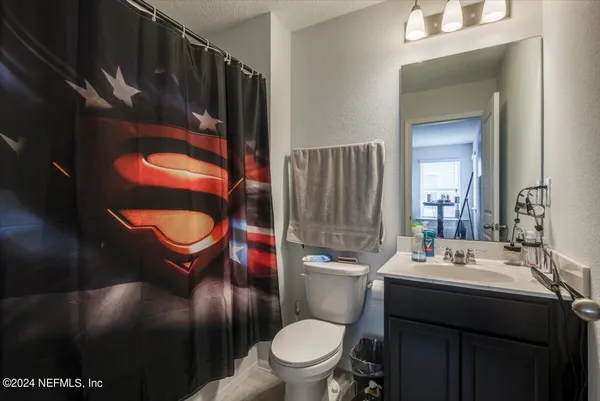 a room with a bed and window