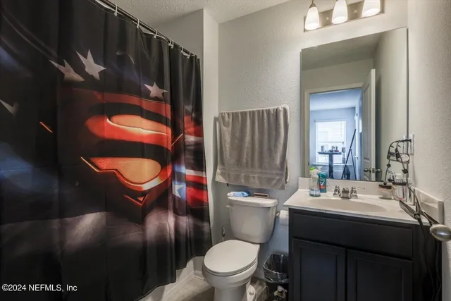 a room with a bed and window