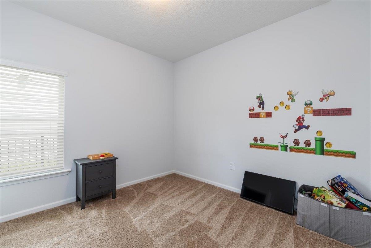 668 Watervale Drive St. Augustine, FL 32092 - Photo 13 of 17 a room with a bed and window