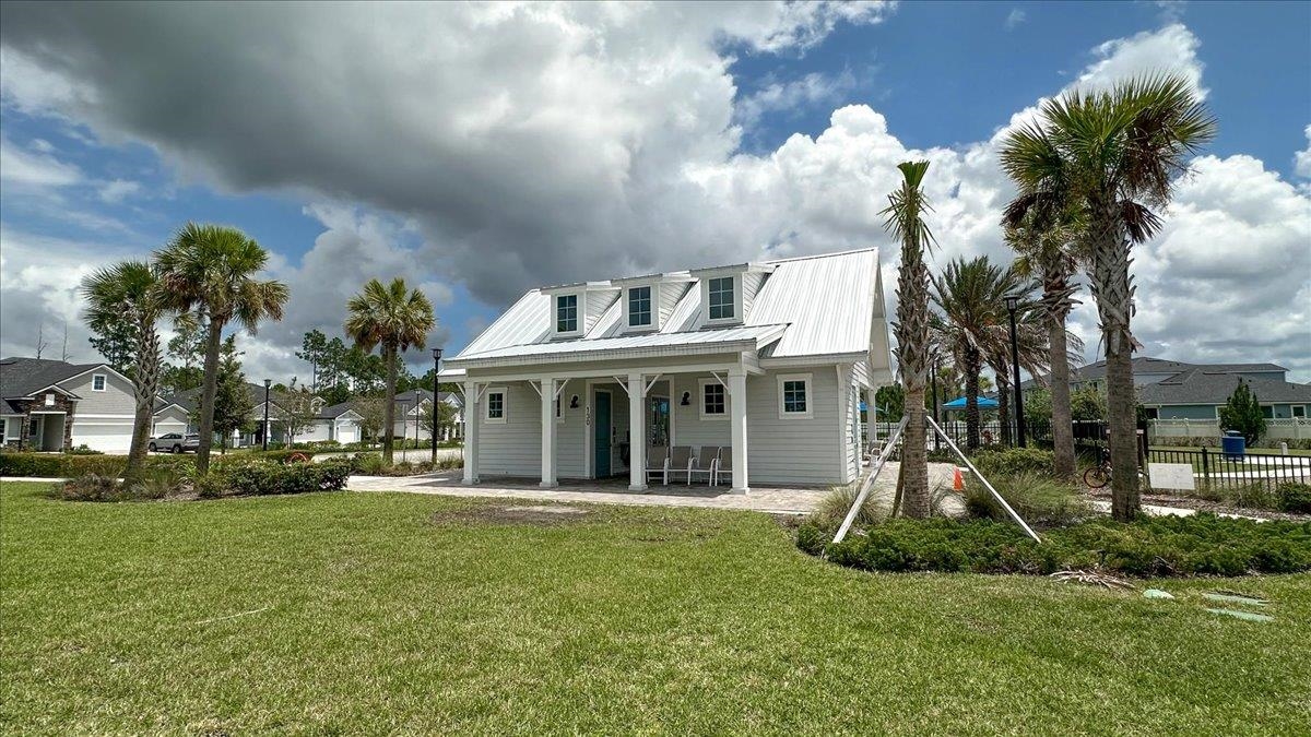 668 Watervale Drive St. Augustine, FL 32092 - Photo 15 of 17 a view of a house with a yard and plants