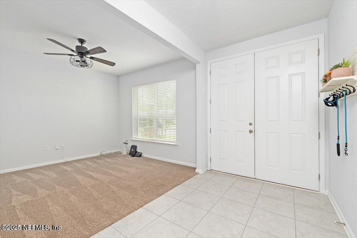668 Watervale Drive St. Augustine, FL 32092 - Photo 3 of 17 an empty room with windows and fan