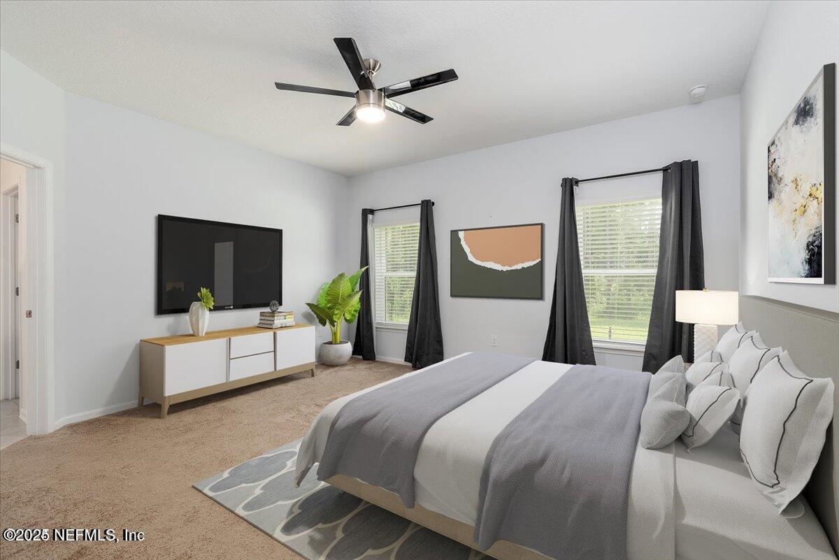 668 Watervale Drive St. Augustine, FL 32092 - Photo 7 of 17 a bedroom with a large bed and a flat screen tv