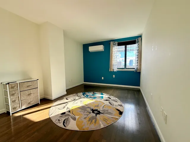 a bathroom with a sink toilet a mirror and shower
