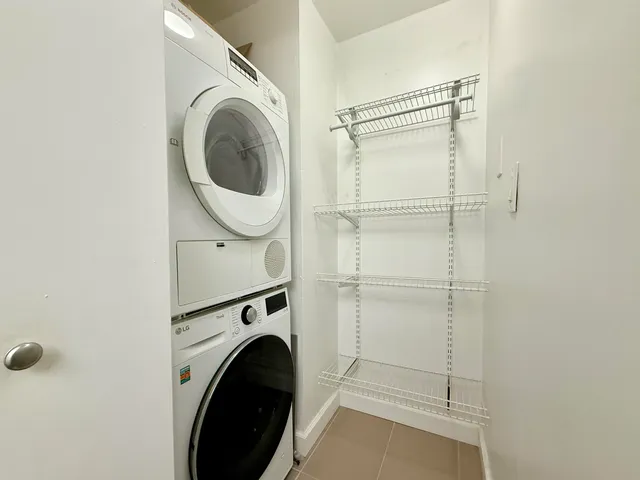 a view of yard from deck with patio