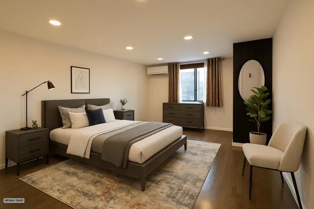 a spacious bedroom with bed and a chair