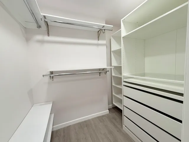 a view of an empty walk in closet