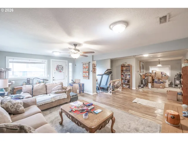 a living room with furniture and a table