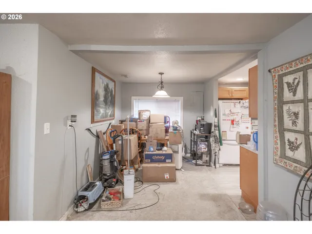 a view of a livingroom with furniture and a window