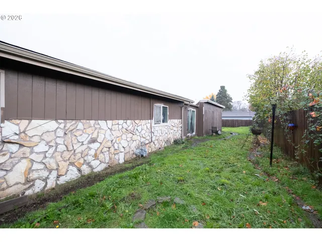 a backyard of a house with lots of green space