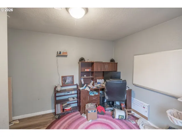 a workspace with furniture and wooden floor