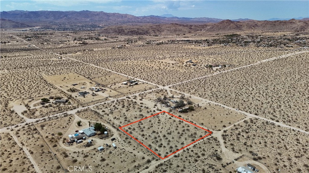 760 Carmel Street Joshua Tree, CA 92252 - Photo 2 of 11 a view of an empty room and mountain view