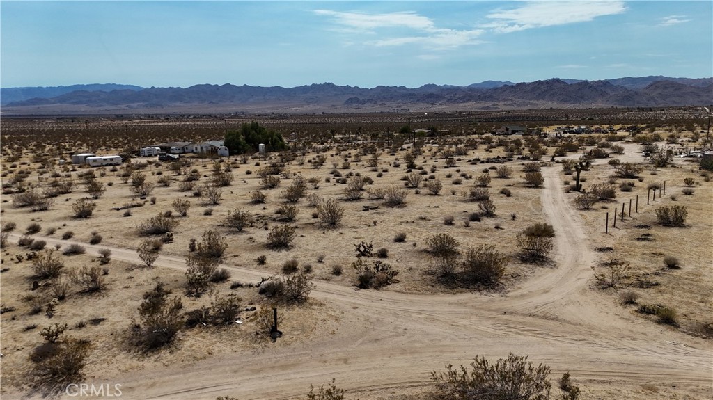 760 Carmel Street Joshua Tree, CA 92252 - Photo 4 of 11 a view of lake with mountain in the background