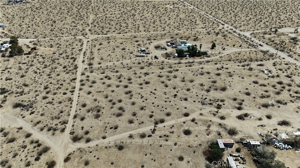 760 Carmel Street Joshua Tree, CA 92252 - Photo 10 of 11 a bathroom with a toilet and a shower curtain