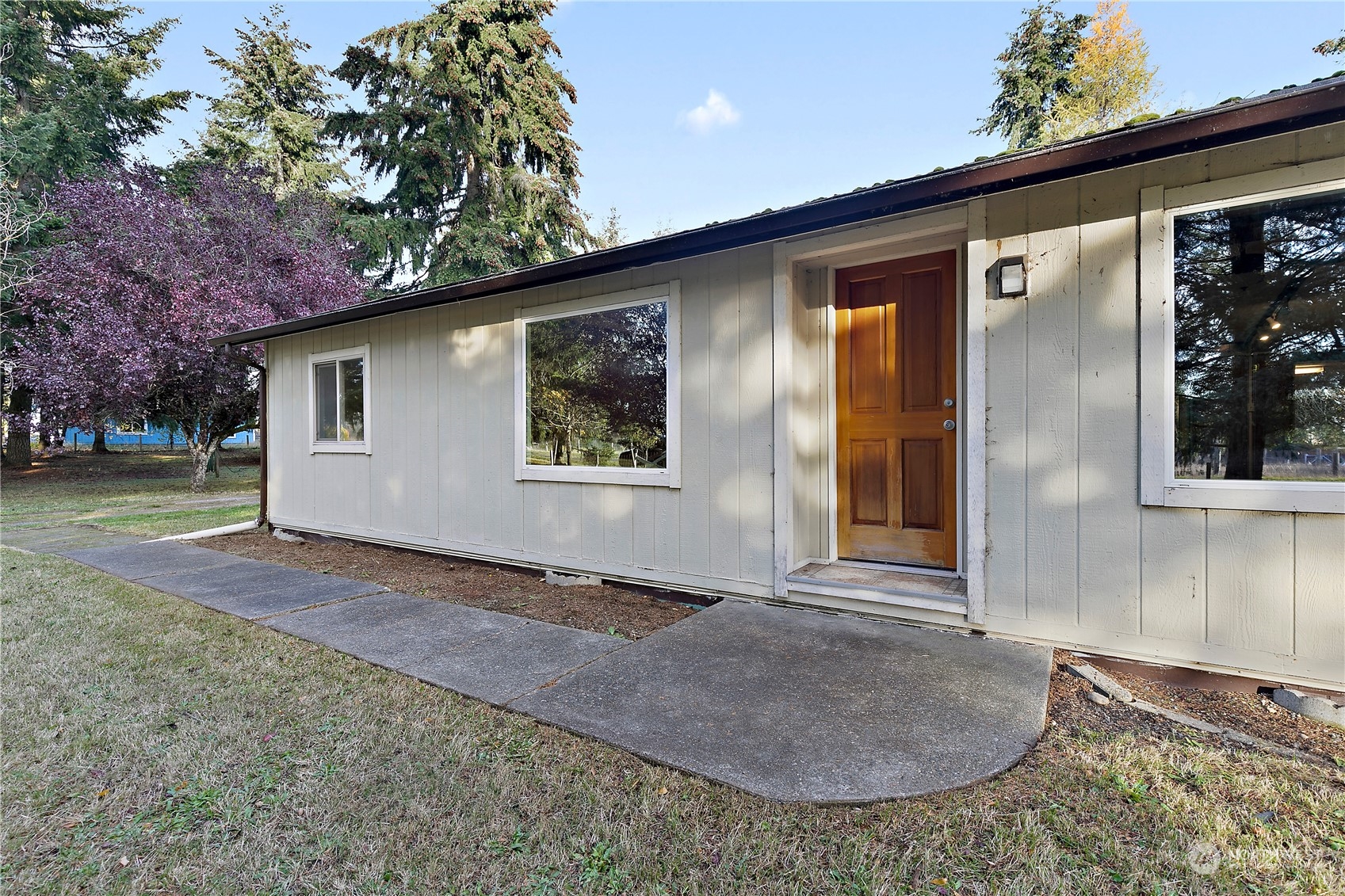 18124 Wakly Lane Southwest Rochester, WA 98579 - Photo 2 of 30 a view of an house with backyard and trees