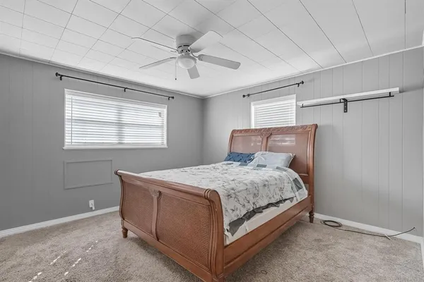 a bedroom with a bed and window