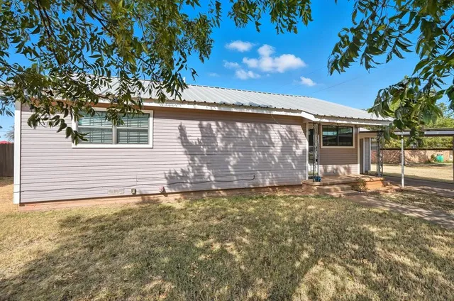 a view of a house with a tree