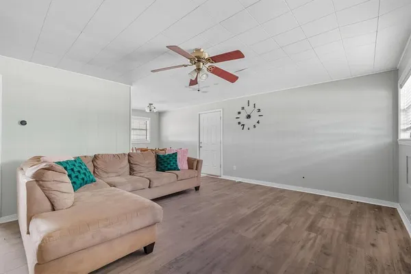 a living room with furniture and white walls