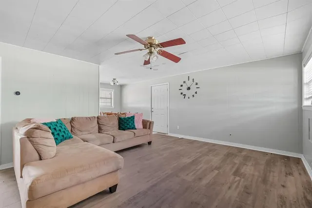 a living room with furniture and white walls