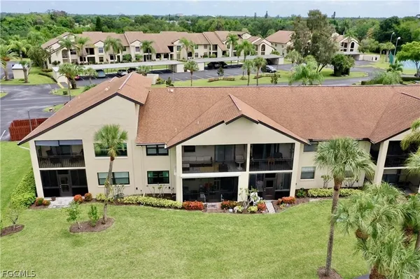 an aerial view of a house with a garden and plants