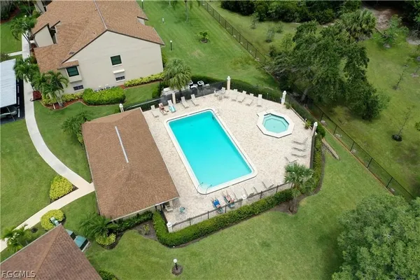 an aerial view of a house with outdoor space