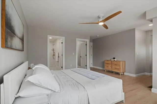 a bedroom with a bed and a dresser