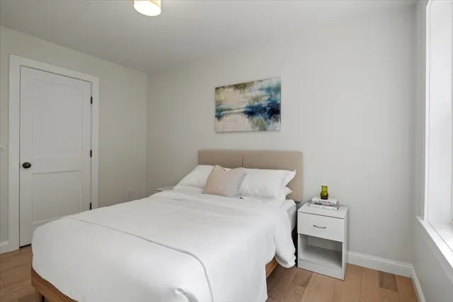 a bedroom with a bed and a table in it