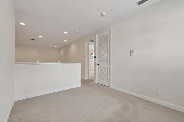 a large bathroom with a tub a sink shower and mirror