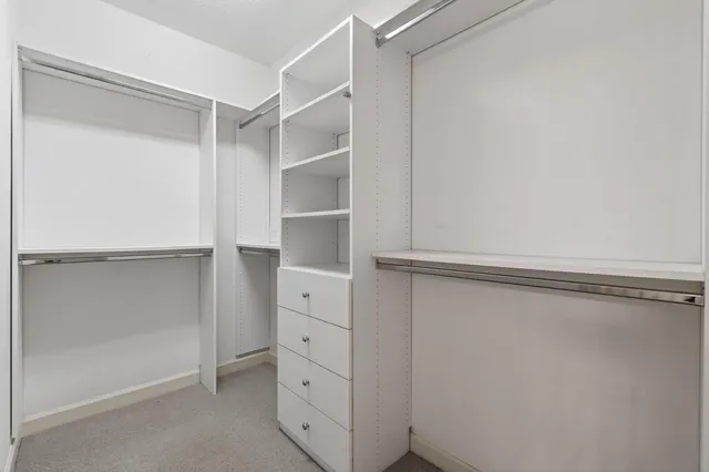 a view of a wooden deck next to a yard