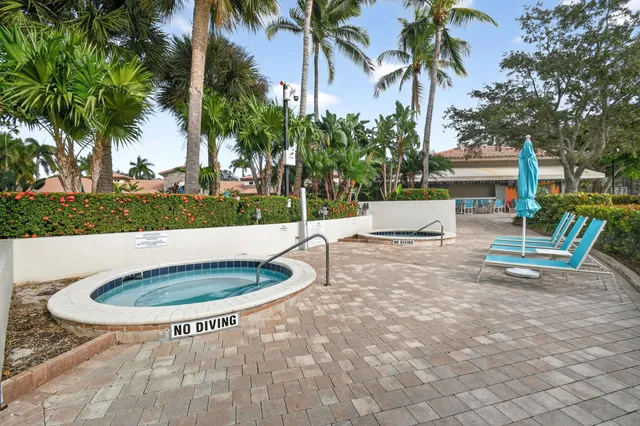 a view of a chairs and table in the patio
