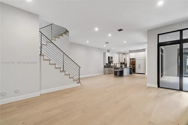 a view of a livingroom with furniture and a chandelier