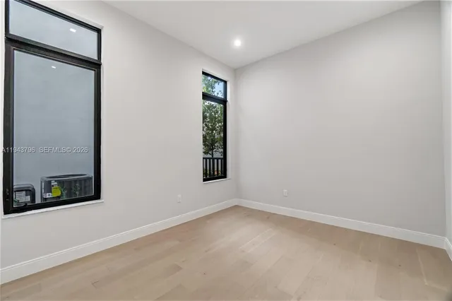 a view of an empty room with a closet