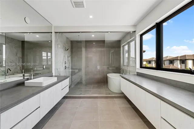 a bathroom with a bathtub and shower