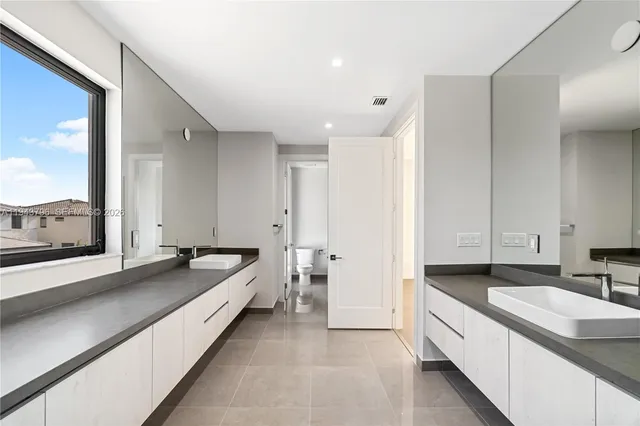 an empty room with a bathroom